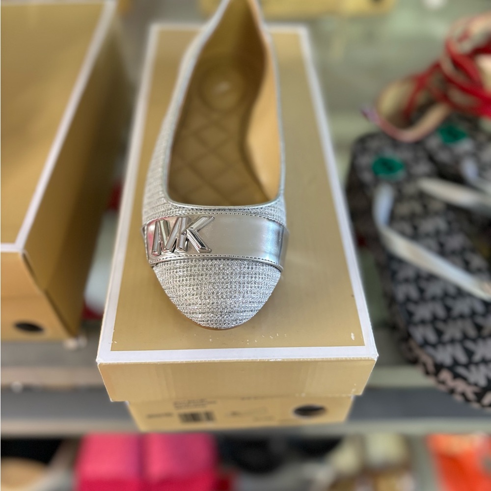 MK size 6.5 silver flats